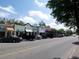 Charming street view with colorful shops, street parking, and vibrant community atmosphere at 254 Seagate Ct, Dunedin, FL 34698