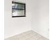 Bright empty bedroom with tile flooring at 2650 Countryside Blvd # B102, Clearwater, FL 33761