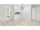 Bright dining room featuring tile flooring and a pass-through to the kitchen at 2650 Countryside Blvd # B102, Clearwater, FL 33761