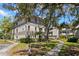 Multi-story condo building showcasing mature landscaping, sidewalks, and inviting outdoor spaces at 2650 Countryside Blvd # B102, Clearwater, FL 33761