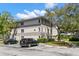 Well-maintained condo building with reserved parking, mature landscaping, and a loading zone at 2650 Countryside Blvd # B102, Clearwater, FL 33761