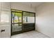 A screened-in porch with neutral decor and a view to the outside at 2650 Countryside Blvd # B102, Clearwater, FL 33761