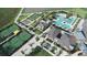 A beautiful aerial view of community amenities including tennis courts, pools and shuffleboard at 31794 Griffin Sands Ln, San Antonio, FL 33576