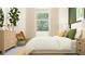 Bedroom with a comfy bed, stylish furnishings, and abundant natural light at 31794 Griffin Sands Ln, San Antonio, FL 33576