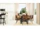 The dining room includes a dining table and seating with matching decorative accessories and a sideboard at 31794 Griffin Sands Ln, San Antonio, FL 33576