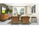 A spacious living room with seating, a modern TV, and a neutral color palette, creating a relaxing atmosphere at 31794 Griffin Sands Ln, San Antonio, FL 33576
