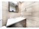 Cozy bathroom featuring shiplap accents, a modern vanity, and updated fixtures for a fresh look at 3219 Spanish Moss Ln, Palm Harbor, FL 34684