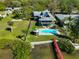 Aerial view of a waterfront home with a pool, gazebo, and private dock at 352 Shore E Dr, Oldsmar, FL 34677