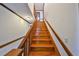 View of the staircase with wooden steps and railing at 352 Shore E Dr, Oldsmar, FL 34677