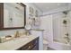 Bathroom featuring a vanity with granite countertops, a mirror, and a shower-tub combination at 3632 Pine Cone Cir, Clearwater, FL 33760