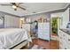 Bedroom featuring a ceiling fan, wood floors, and furniture at 3632 Pine Cone Cir, Clearwater, FL 33760