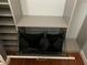 Closet with built-in shelving and pull out laundry bin at 3632 Pine Cone Cir, Clearwater, FL 33760