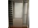 Walk-in closet featuring built-in organizers including drawers and shelves at 3632 Pine Cone Cir, Clearwater, FL 33760