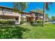 Charming townhome with manicured lawn, mature trees, and inviting curb appeal, located in a desirable neighborhood at 3632 Pine Cone Cir, Clearwater, FL 33760