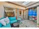 Relaxing screened patio with skylight, comfortable seating, and decorative accents, perfect for outdoor living at 3632 Pine Cone Cir, Clearwater, FL 33760