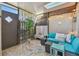 Relaxing outdoor patio area featuring comfortable seating, stylish decor, and a serene ambiance at 3632 Pine Cone Cir, Clearwater, FL 33760