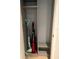 Functional storage closet with shelving and space for cleaning supplies and organization at 3632 Pine Cone Cir, Clearwater, FL 33760