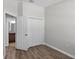 Bedroom with wood floors, closet and attached bathroom at 4081 71St N Ter, Pinellas Park, FL 33781