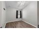 Bedroom with ceiling fan, modern flooring, and a bright window with drapes at 4081 71St N Ter, Pinellas Park, FL 33781