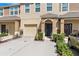 A well-maintained multi-Gathering unit with attached garages and manicured landscaping creates inviting curb appeal at 4081 71St N Ter, Pinellas Park, FL 33781