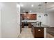 Modern kitchen featuring stainless steel appliances, dark wood cabinets, granite counters, and tiled floors at 4081 71St N Ter, Pinellas Park, FL 33781