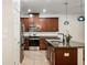 Modern kitchen featuring stainless steel appliances, granite countertops, and an island sink with pendant lighting at 4081 71St N Ter, Pinellas Park, FL 33781