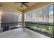 Enclosed screened porch with fan and views of the outside bushes at 4081 71St N Ter, Pinellas Park, FL 33781