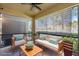 Staged screened porch with outdoor seating and foliage at 4081 71St N Ter, Pinellas Park, FL 33781