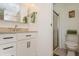 Bathroom featuring a single sink vanity, a toilet, and a glass door shower at 443 Tuna Ct, Oldsmar, FL 34677