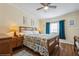 Bedroom featuring neutral walls, wood floors, and a ceiling fan and lots of natural light at 443 Tuna Ct, Oldsmar, FL 34677
