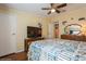 Comfortable bedroom with hardwood floors, ceiling fan and closet with a tv stand at 443 Tuna Ct, Oldsmar, FL 34677