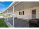 Long covered carport area with a grill for outdoor cooking at 443 Tuna Ct, Oldsmar, FL 34677