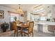 Charming dining space with an eat-in kitchen featuring tile flooring, offering a bright space for everyday meals at 443 Tuna Ct, Oldsmar, FL 34677
