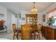 Elegant dining room featuring a wooden dining set and display cabinet for cherished items at 443 Tuna Ct, Oldsmar, FL 34677