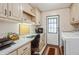 Bright laundry room with washer and dryer and a desk area for added convenience at 443 Tuna Ct, Oldsmar, FL 34677