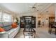 Spacious living room featuring a large TV, stylish decor, and an open layout for entertaining guests at 443 Tuna Ct, Oldsmar, FL 34677