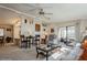 Cozy living room showing open layout to dining area and access to the sunroom at 443 Tuna Ct, Oldsmar, FL 34677