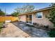 Outside the house is a large concrete patio area with glass sliding doors at 4811 Daphne St, New Port Richey, FL 34652