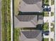 Aerial view of rooftops and driveways, capturing the layout of a residential neighborhood at 7229 Spring Snowflake Ave, Tampa, FL 33619