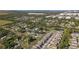 Aerial photo showing the mix of residential and commercial properties alongside green spaces and bodies of water at 7229 Spring Snowflake Ave, Tampa, FL 33619