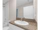Bathroom with shower, sink, granite countertop, and large mirror at 7229 Spring Snowflake Ave, Tampa, FL 33619
