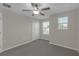 Bedroom with neutral walls, carpet, ceiling fan, and a double door closet at 7229 Spring Snowflake Ave, Tampa, FL 33619