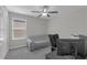 Bedroom featuring neutral walls, carpet, ceiling fan, and natural light at 7229 Spring Snowflake Ave, Tampa, FL 33619