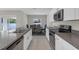 Modern kitchen with stainless steel appliances, white cabinetry, and breakfast nook at 7229 Spring Snowflake Ave, Tampa, FL 33619