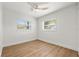 Light bedroom features a modern ceiling fan and sun-filled windows at 7400 19Th N Ave, St Petersburg, FL 33710