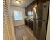 Kitchen featuring granite counters, dark cabinets, and stainless steel appliances at 7529 Pitch Pine Cir # 190, Tampa, FL 33617
