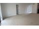 Spacious living room with neutral carpet and bright natural light at 7529 Pitch Pine Cir # 190, Tampa, FL 33617