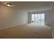 Bright living room featuring a large sliding door leading to the outside at 7529 Pitch Pine Cir # 190, Tampa, FL 33617