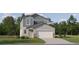 Two-story home featuring a two-car garage and a combination of gray siding at 8429 Sea Ray Run, Parrish, FL 34219