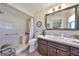 Bathroom featuring a walk-in shower, neutral walls, and decorative tile flooring at 902 Chipaway Dr, Apollo Beach, FL 33572